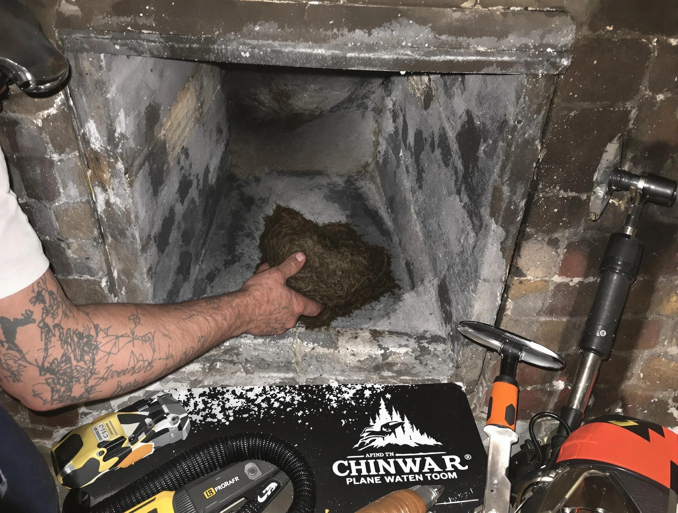 Braintree Chimney Sweep safely removing debris and screening chimney in Braintree, MA