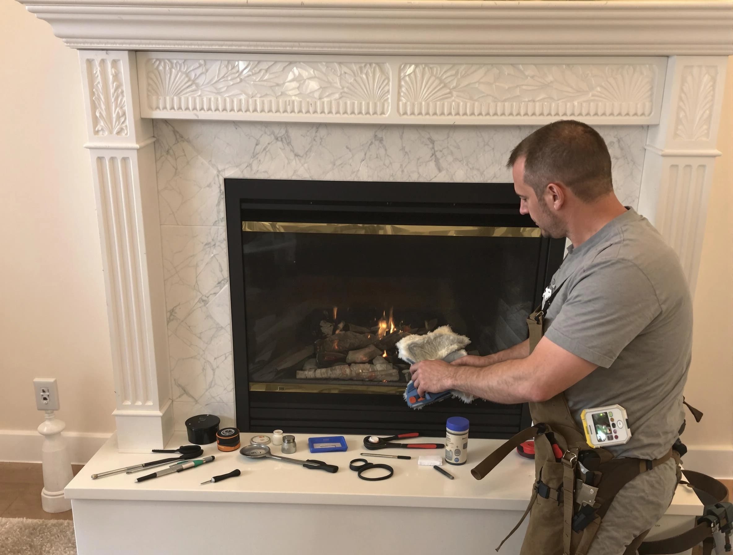 Braintree Chimney Sweep performing fireplace maintenance in Braintree, MA